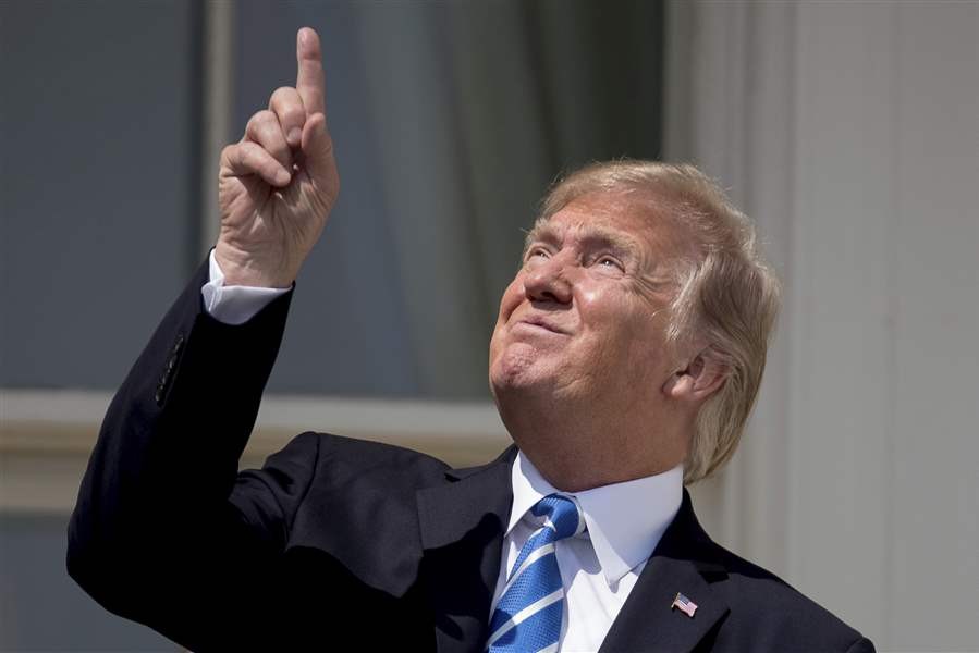 Trump staring at eclipse